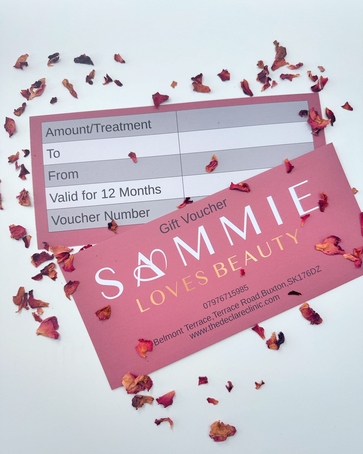 Sammie Loves Beauty gift vouchers scattered with rose petals