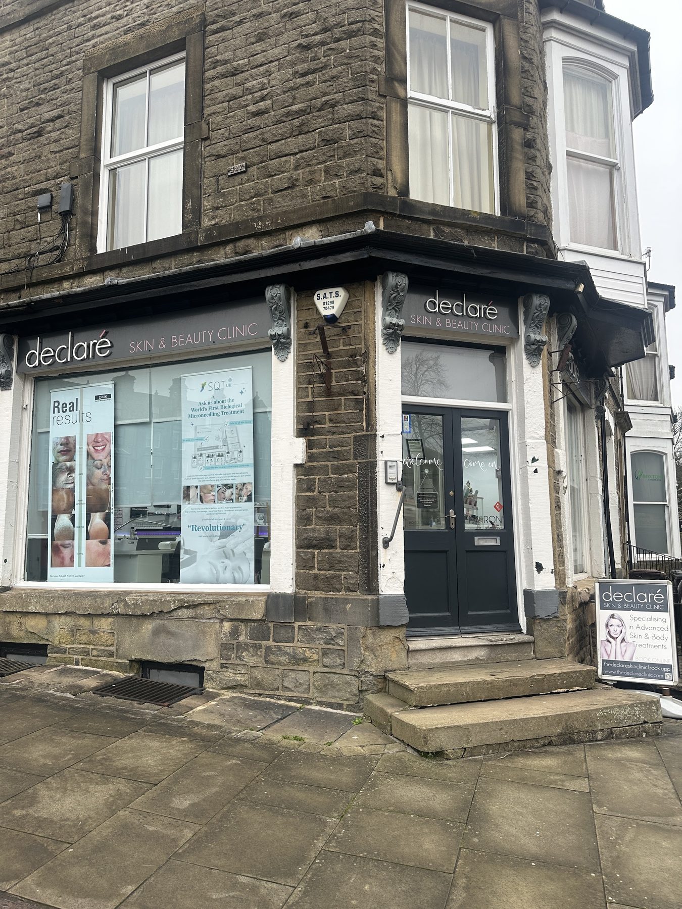 The front door of declaré Skin and Beauty Clinic with its A-board outside